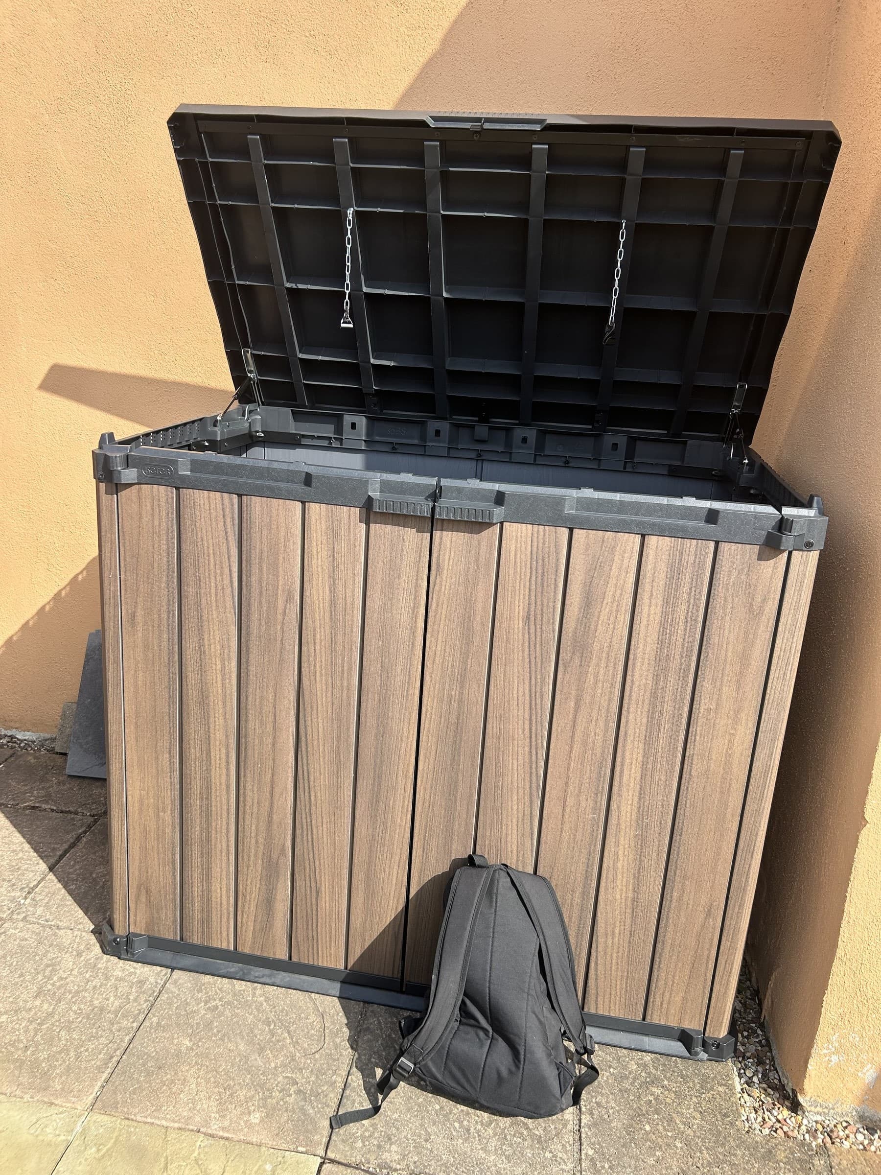 Assembled composite bin storage box with lid open showing the internal frame