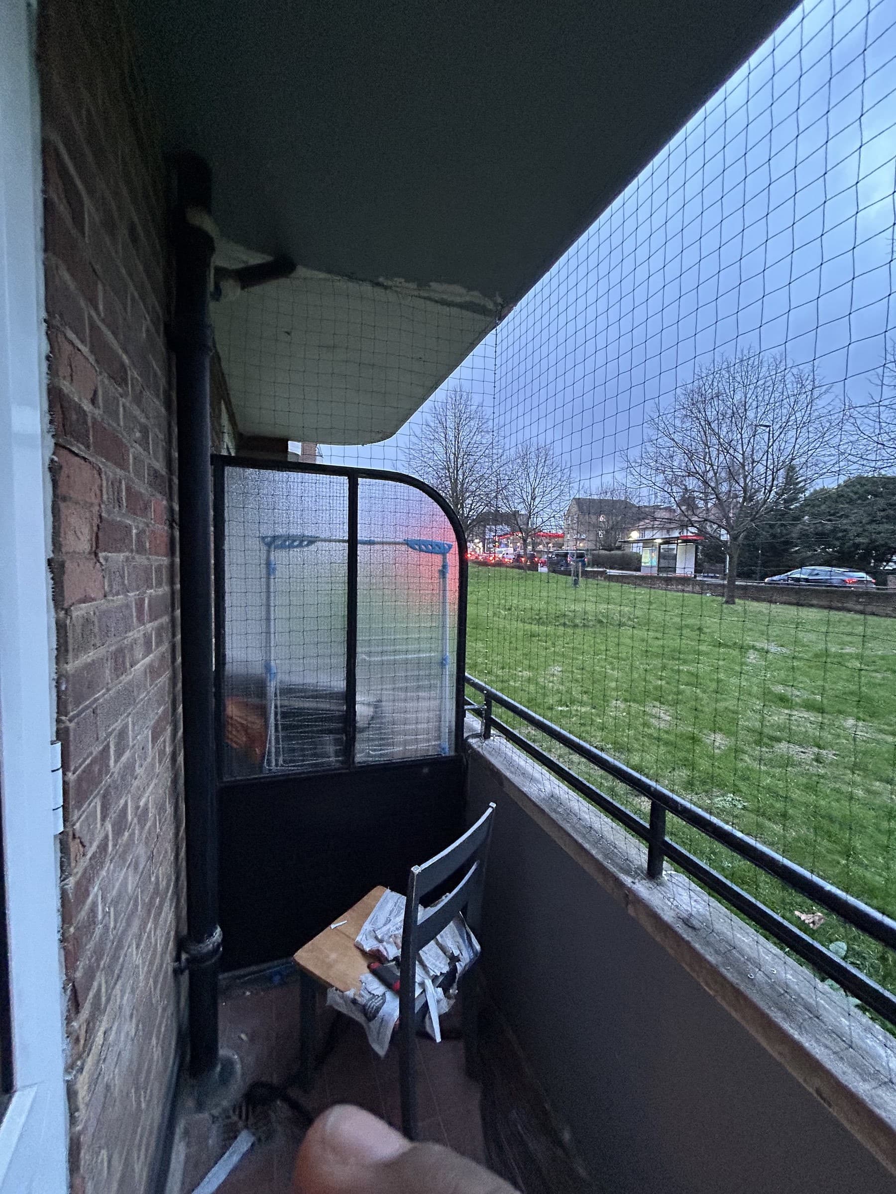 Balcony fully fitted with a safety net spanning the railing
