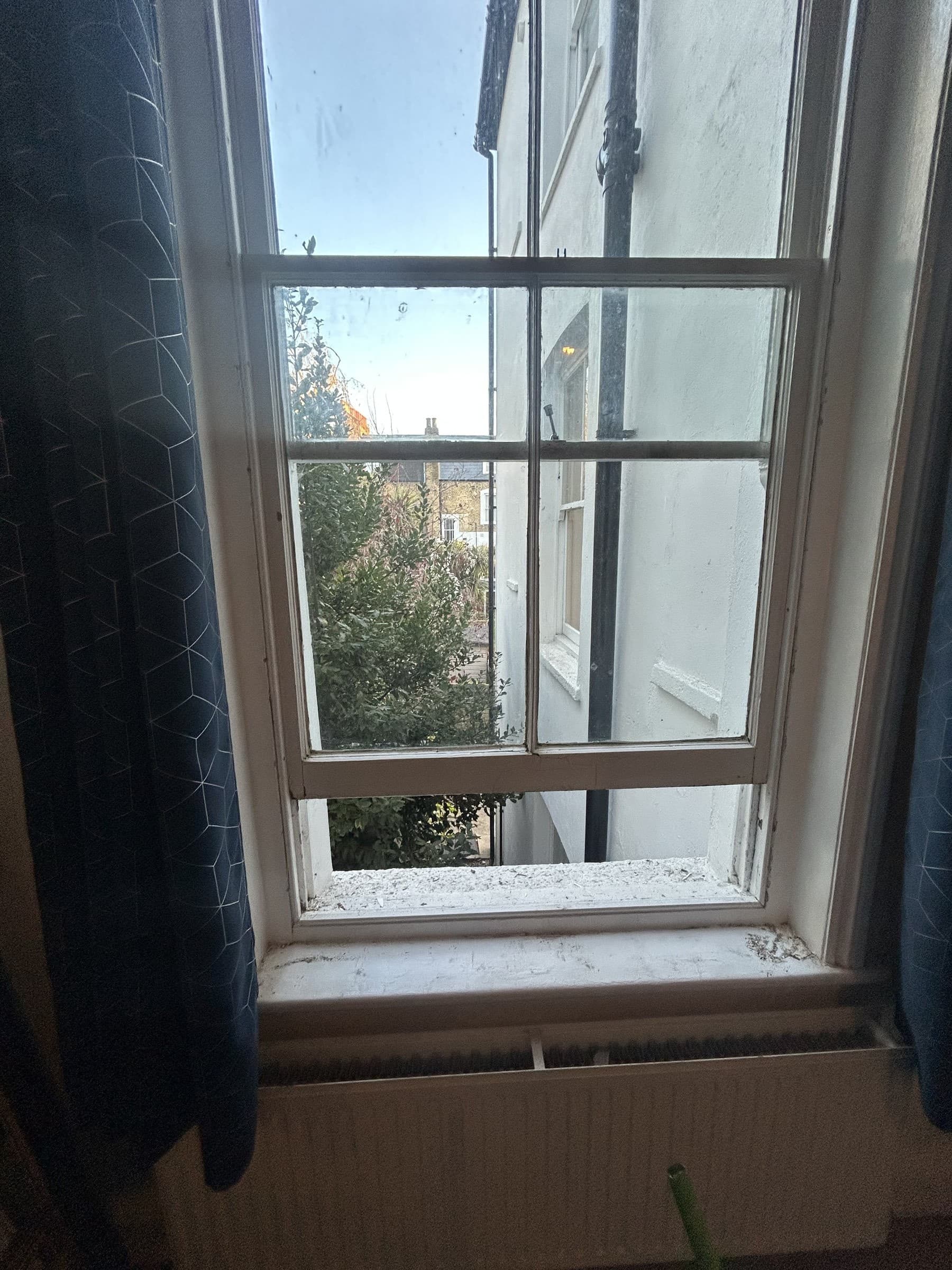 Repaired sash window operating smoothly, viewed from the window seat