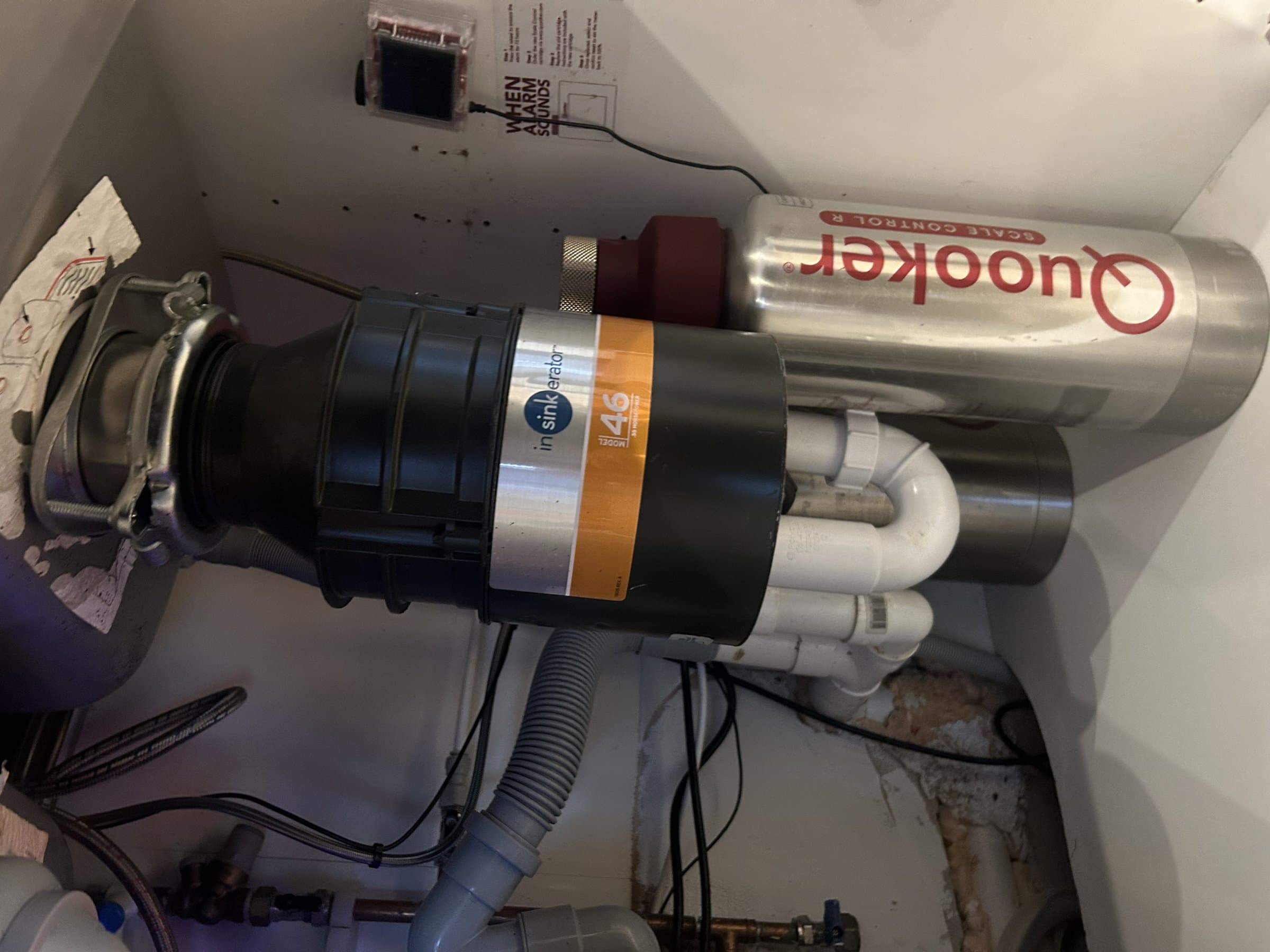 InSinkErator waste disposal unit newly installed and plumbed in under a kitchen sink