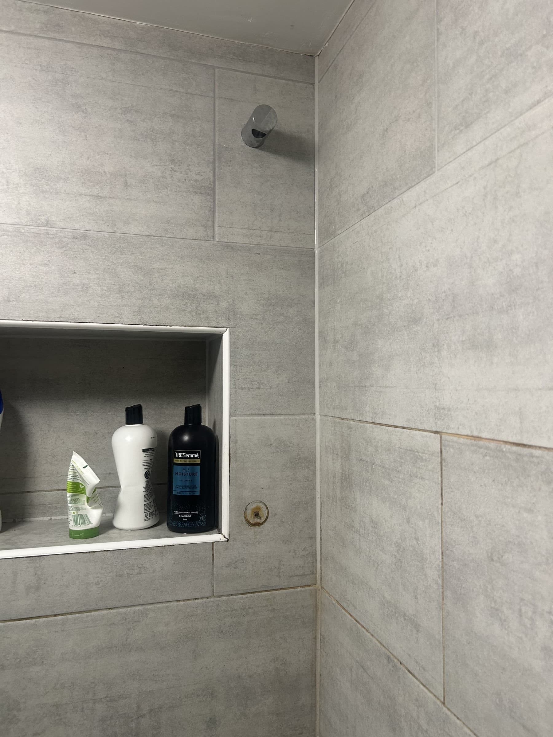 Empty shower alcove bracket with no shower rail or head fitted, before replacement